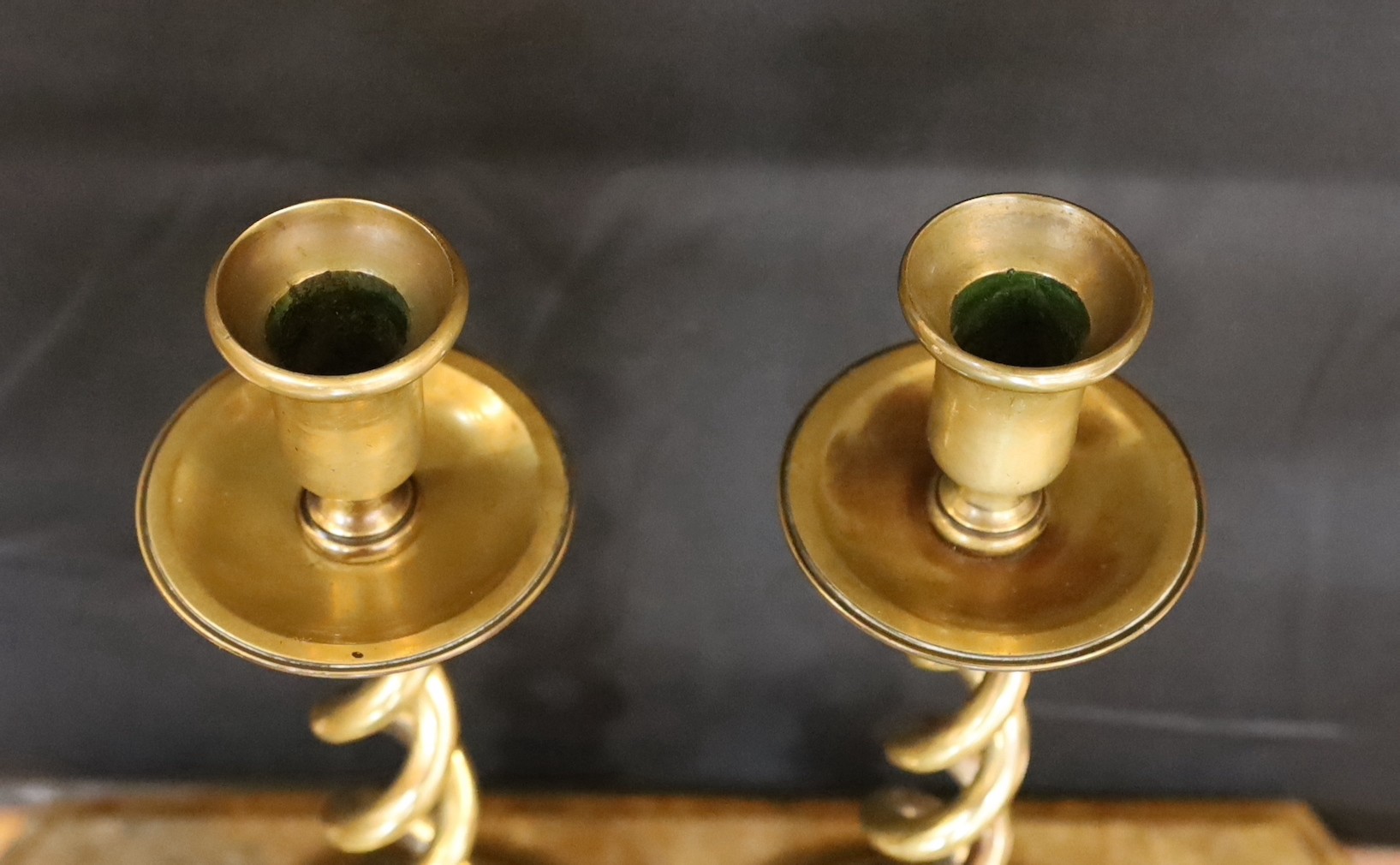 A pair of Victorian brass spiral twist candlesticks and a later seven light candelabrum, candlesticks 27cm. candelabrum 32cm